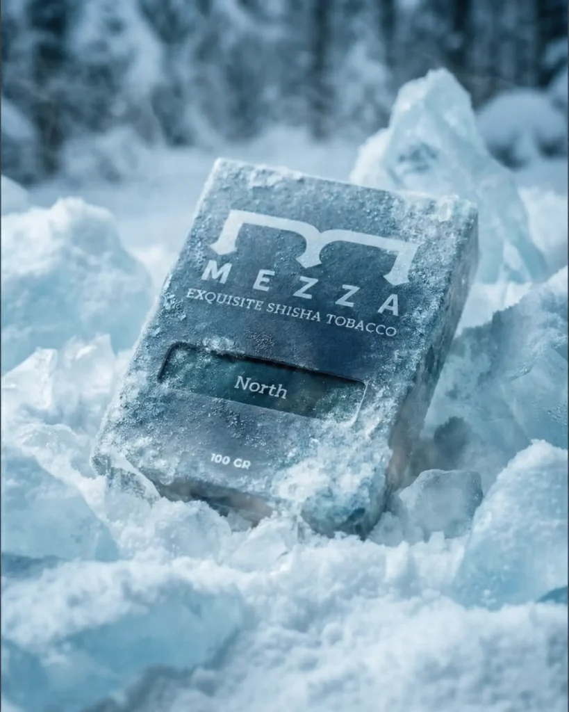 A premium pack of Mezza North ice tobacco frozen inside a block of ice to illustrate its maximum frost and intense cooling power.