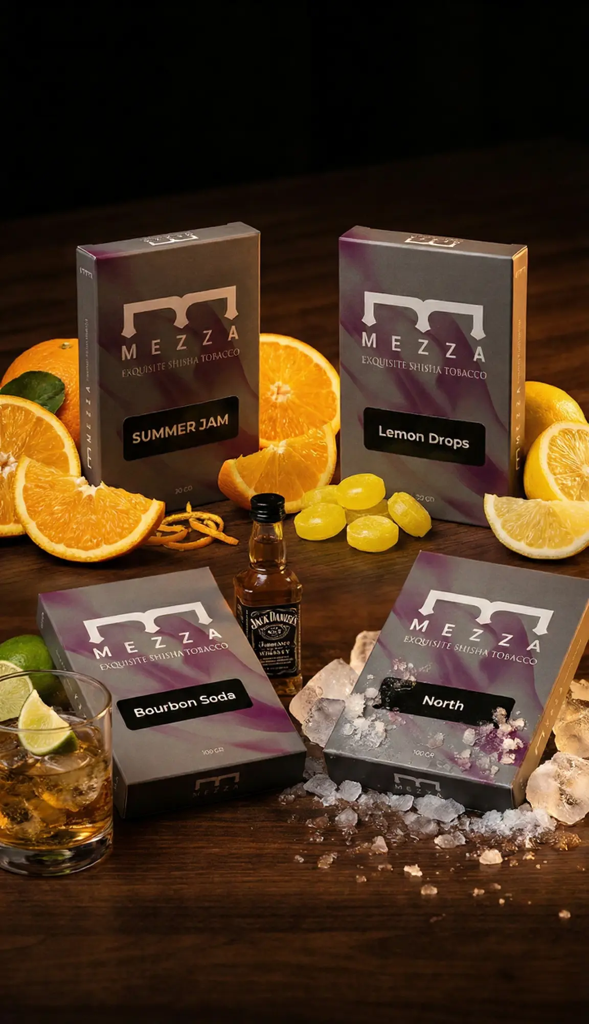 A refreshing Bourbon Sour Freeze hookah flavor mix display showing Mezza boxes of Summer Jam, Lemon Drops, Bourbon Soda, and North, surrounded by fresh orange slices, lemon candies, a mini whiskey bottle, and crushed ice.