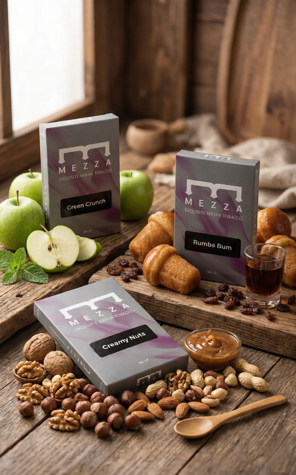 The creamy Caramel Rum Sour hookah flavor mix featuring Mezza's Green Crunch, Rumba Bum, and Creamy Nuts boxes, beautifully arranged on a rustic wooden surface with fresh green apples, rum cakes, mixed nuts, and caramel.