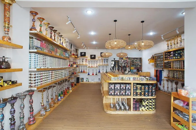 A brightly lit retail store displaying a wide selection of hookahs, accessories, and premium tobacco at MyShisha Kerobokan, your ultimate destination for where to smoke & buy Mezza in Bali.